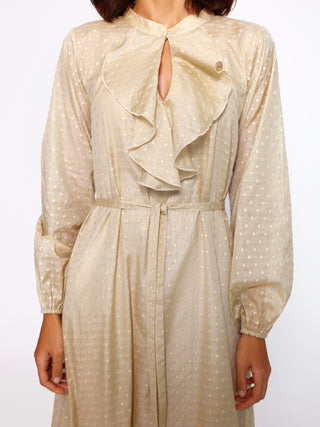 Detail view of gathered waist and ruffled neckline kaftan
