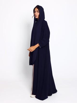 Modern abaya with minimal silhouette and statement cuffs