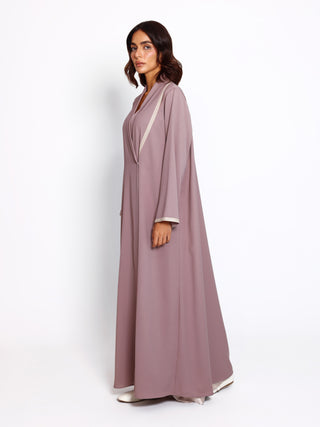 Modern abaya with minimal silhouette and handcrafted detailing