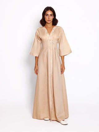 Drawn linen dress with softly shaped waist and flowing silhouette