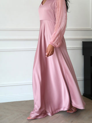 Side view of satin maxi dress in dusty rose with lightweight chiffon sleeves and fluid movement