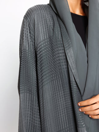 Close up of textured grid detail on washed silk abaya